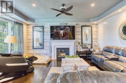 261 Montreal Circle, Hamilton (Stoney Creek), ON - Indoor Photo Showing Living Room With Fireplace