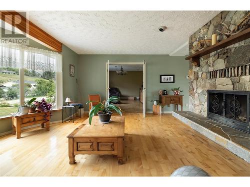 10108 Venables Drive, Coldstream, BC - Indoor Photo Showing Living Room With Fireplace