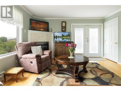 10108 Venables Drive, Coldstream, BC - Indoor Photo Showing Living Room With Fireplace