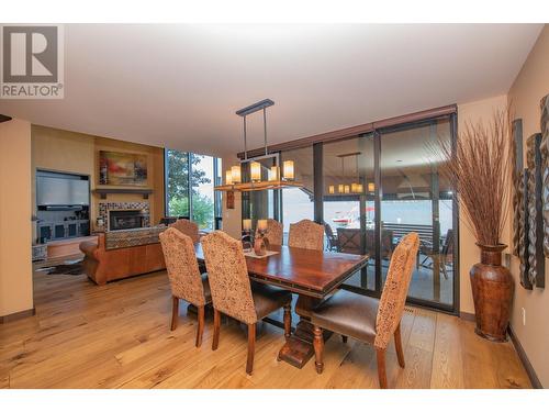 8595 Okanagan Landing Road, Vernon, BC - Indoor Photo Showing Dining Room With Fireplace