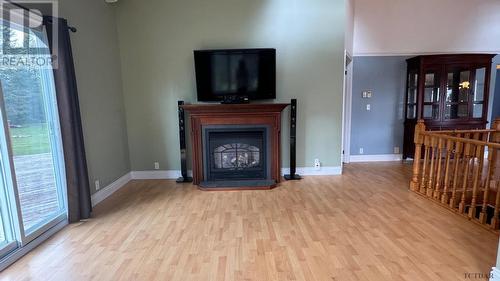 789 Hwy 652, Cochrane, ON - Indoor Photo Showing Other Room With Fireplace