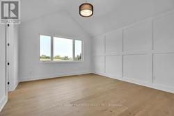 PRIMARY BEDROOM WITH VAULTED CEILING - 