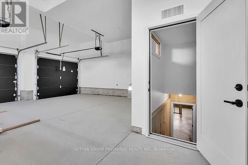 2 CAR GARAGE WITH ENTRANCE TO BASEMENT - 868 Eagletrace Drive, London, ON - Indoor Photo Showing Garage