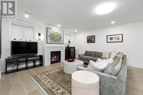 47 Ambleside Avenue, Toronto, ON - Indoor Photo Showing Living Room With Fireplace