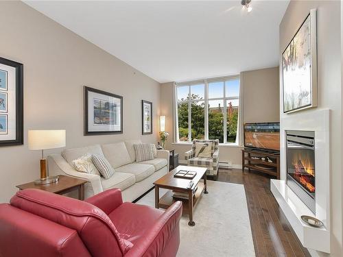 215-999 Burdett Ave, Victoria, BC - Indoor Photo Showing Living Room With Fireplace