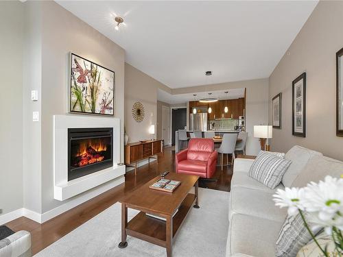 215-999 Burdett Ave, Victoria, BC - Indoor Photo Showing Living Room With Fireplace