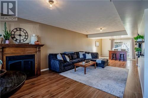 949 Jeanne D'Arc Street, Hanmer, ON - Indoor Photo Showing Living Room With Fireplace