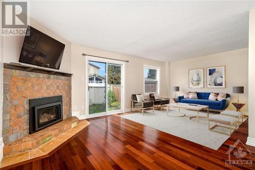 Virtually Staged - 49 Foxfield Drive, Ottawa, ON - Indoor Photo Showing Living Room With Fireplace