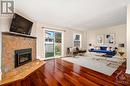 Virtually Staged - 49 Foxfield Drive, Ottawa, ON  - Indoor Photo Showing Living Room With Fireplace 