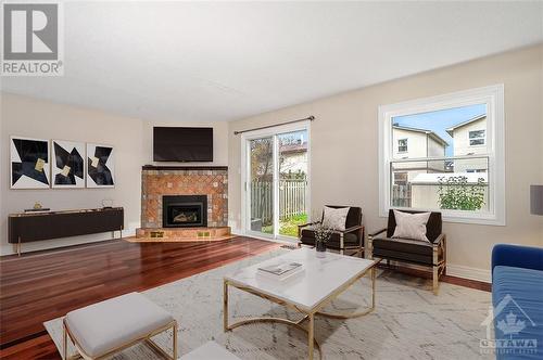 Virtually Staged - 49 Foxfield Drive, Ottawa, ON - Indoor Photo Showing Living Room With Fireplace