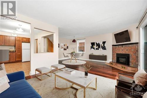 Virtually Staged - 49 Foxfield Drive, Ottawa, ON - Indoor Photo Showing Living Room With Fireplace