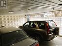 207 525 3Rd Avenue N, Saskatoon, SK  - Indoor Photo Showing Garage 