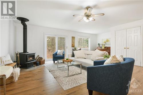 Cozy wood burning stove - 4207 Limestone Road, Ottawa, ON - Indoor Photo Showing Living Room