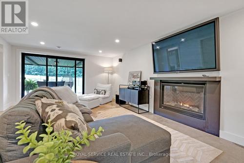 4566 Harwood Road, Hamilton Township, ON - Indoor Photo Showing Living Room With Fireplace