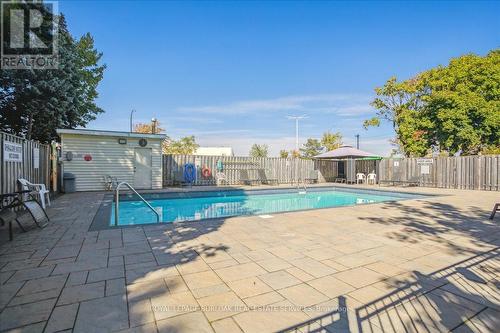 206 - 700 Dynes Road, Burlington, ON - Outdoor With In Ground Pool