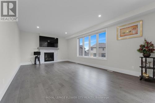 130 Birdie Court, Woodstock, ON - Indoor Photo Showing Living Room With Fireplace