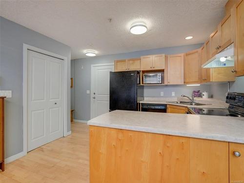 102-2844 Bryn Maur Rd, Langford, BC - Indoor Photo Showing Kitchen With Double Sink