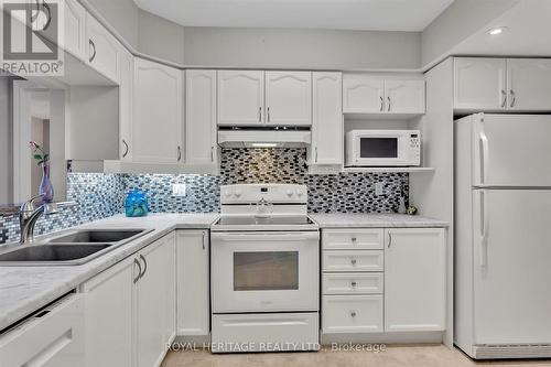 106 - 3 Heritage Way, Kawartha Lakes (Lindsay), ON - Indoor Photo Showing Kitchen With Double Sink