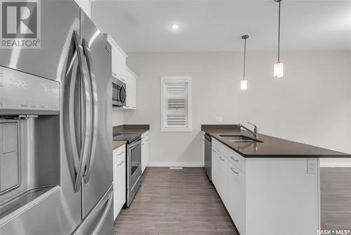 122 315 Dickson Crescent, Saskatoon, SK - Indoor Photo Showing Kitchen With Double Sink With Upgraded Kitchen