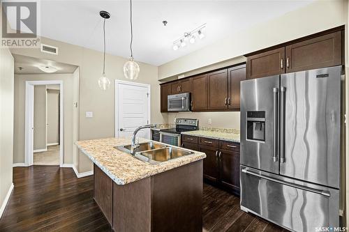 212 4501 Child Avenue, Regina, SK - Indoor Photo Showing Kitchen With Stainless Steel Kitchen With Double Sink With Upgraded Kitchen