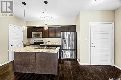 212 4501 Child Avenue, Regina, SK - Indoor Photo Showing Kitchen With Stainless Steel Kitchen With Double Sink With Upgraded Kitchen