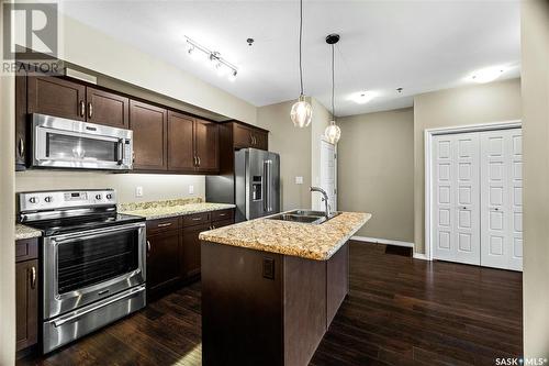 212 4501 Child Avenue, Regina, SK - Indoor Photo Showing Kitchen With Stainless Steel Kitchen With Double Sink With Upgraded Kitchen