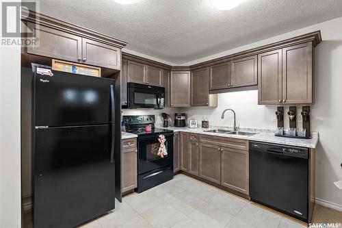 1058 Kloppenburg Bend, Saskatoon, SK - Indoor Photo Showing Kitchen With Double Sink