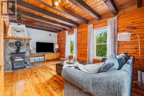 255 Main Street, Stone Mills, ON - Indoor Photo Showing Living Room With Fireplace