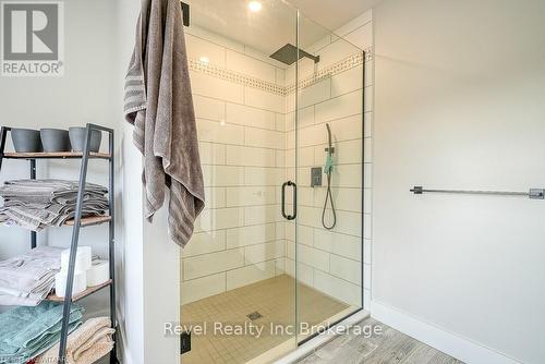 Bathroom featuring vanity and hardwood / wood-style floors - 82 Sunview Drive, Norwich, ON - Indoor Photo Showing Bathroom