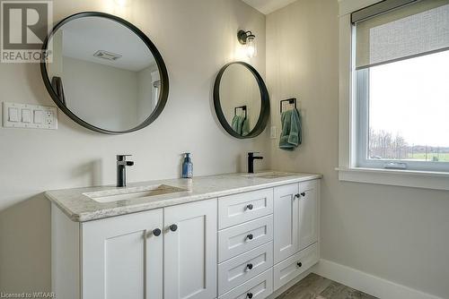 Bathroom featuring wood-type flooring and vanity - 82 Sunview Drive, Norwich, ON - Indoor Photo Showing Bathroom