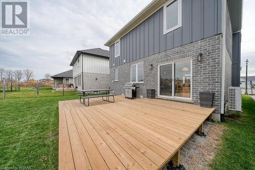 Wooden terrace with area for grilling and a lawn - 82 Sunview Drive, Norwich, ON - Outdoor With Deck Patio Veranda With Exterior