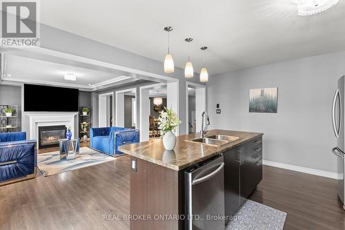 14 Carroll Lane, Brantford, ON - Indoor Photo Showing Kitchen With Fireplace With Double Sink