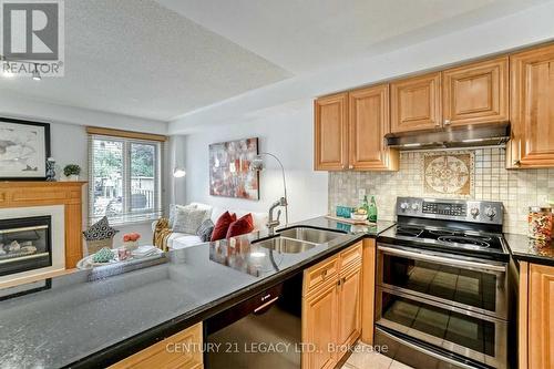 1098 Carding Mill Place, Mississauga, ON - Indoor Photo Showing Kitchen With Fireplace With Double Sink