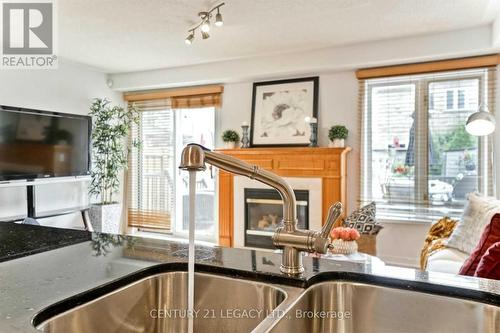 1098 Carding Mill Place, Mississauga, ON - Indoor Photo Showing Kitchen With Fireplace With Double Sink