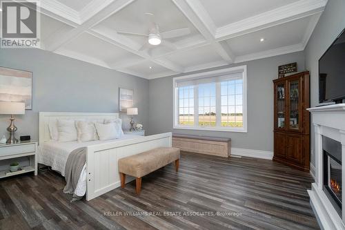 6-7 - 321312 Concession Road, East Luther Grand Valley, ON - Indoor Photo Showing Bedroom With Fireplace