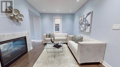 11 Mugford Crescent, Brampton, ON - Indoor Photo Showing Living Room With Fireplace