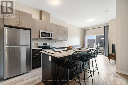 602 - 102 Grovewood Common Crescent, Oakville, ON - Indoor Photo Showing Kitchen With Stainless Steel Kitchen