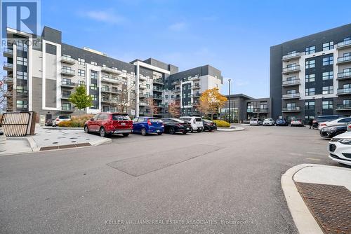 602 - 102 Grovewood Common Crescent, Oakville, ON - Outdoor With Balcony With Facade