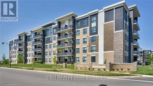 406 - 620 Sauve Street, Milton, ON - Outdoor With Balcony With Facade