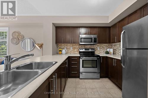 23 - 5625 Oscar Peterson Boulevard, Mississauga, ON - Indoor Photo Showing Kitchen With Double Sink With Upgraded Kitchen