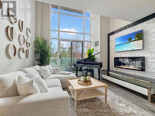 210 - 200 Manitoba Street, Toronto, ON - Indoor Photo Showing Living Room With Fireplace