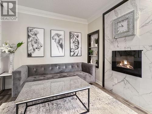 210 - 200 Manitoba Street, Toronto, ON - Indoor Photo Showing Living Room With Fireplace