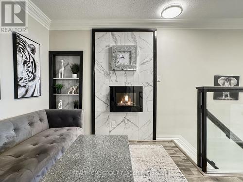 210 - 200 Manitoba Street, Toronto, ON - Indoor Photo Showing Living Room With Fireplace