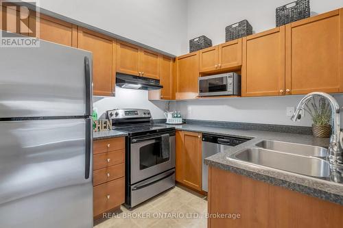 408 - 1340 Main Street E, Milton, ON - Indoor Photo Showing Kitchen With Stainless Steel Kitchen With Double Sink