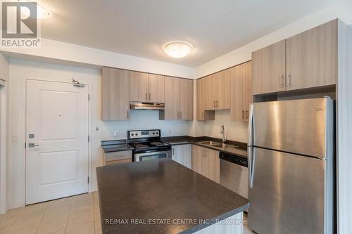 723 - 2486 Old Bronte Road, Oakville, ON - Indoor Photo Showing Kitchen With Stainless Steel Kitchen With Double Sink