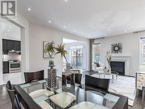 94 Barrow Avenue, Bradford West Gwillimbury, ON - Indoor Photo Showing Dining Room With Fireplace