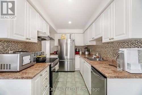 18 Monaco Court, Brampton, ON - Indoor Photo Showing Kitchen With Double Sink With Upgraded Kitchen