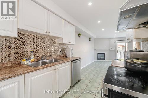 18 Monaco Court, Brampton, ON - Indoor Photo Showing Kitchen With Fireplace With Double Sink With Upgraded Kitchen