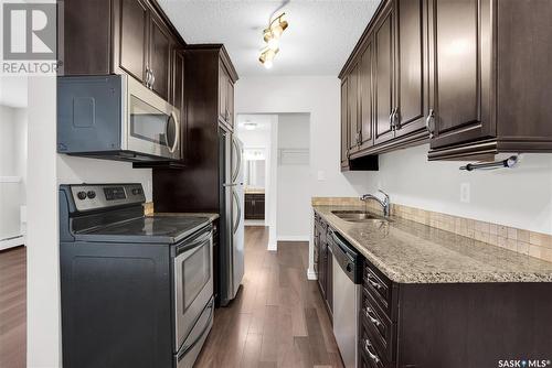 107 208 Saskatchewan Street, Saskatoon, SK - Indoor Photo Showing Kitchen With Double Sink