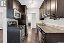 107 208 Saskatchewan Street, Saskatoon, SK  - Indoor Photo Showing Kitchen With Double Sink 